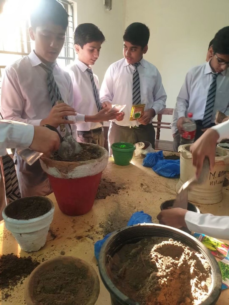 EGS students planting and learning together